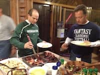 Steve Carp and Jim Lineweaver eat some breakfast at EO Outing