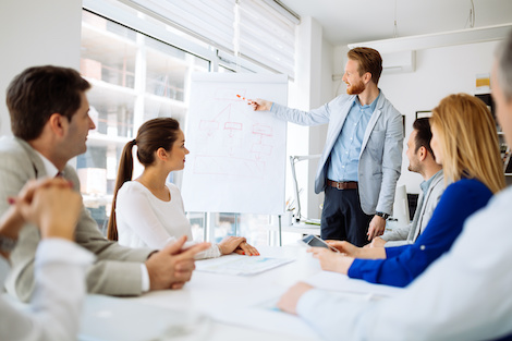 Professionals meeting in conference room discussing HubSpot strategy