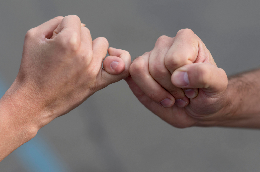 Close up of a pinky swear